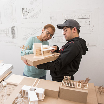 Professor and student with architecture model