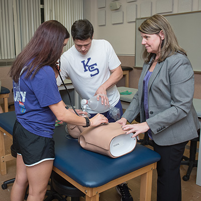 Students practicing emergency health care