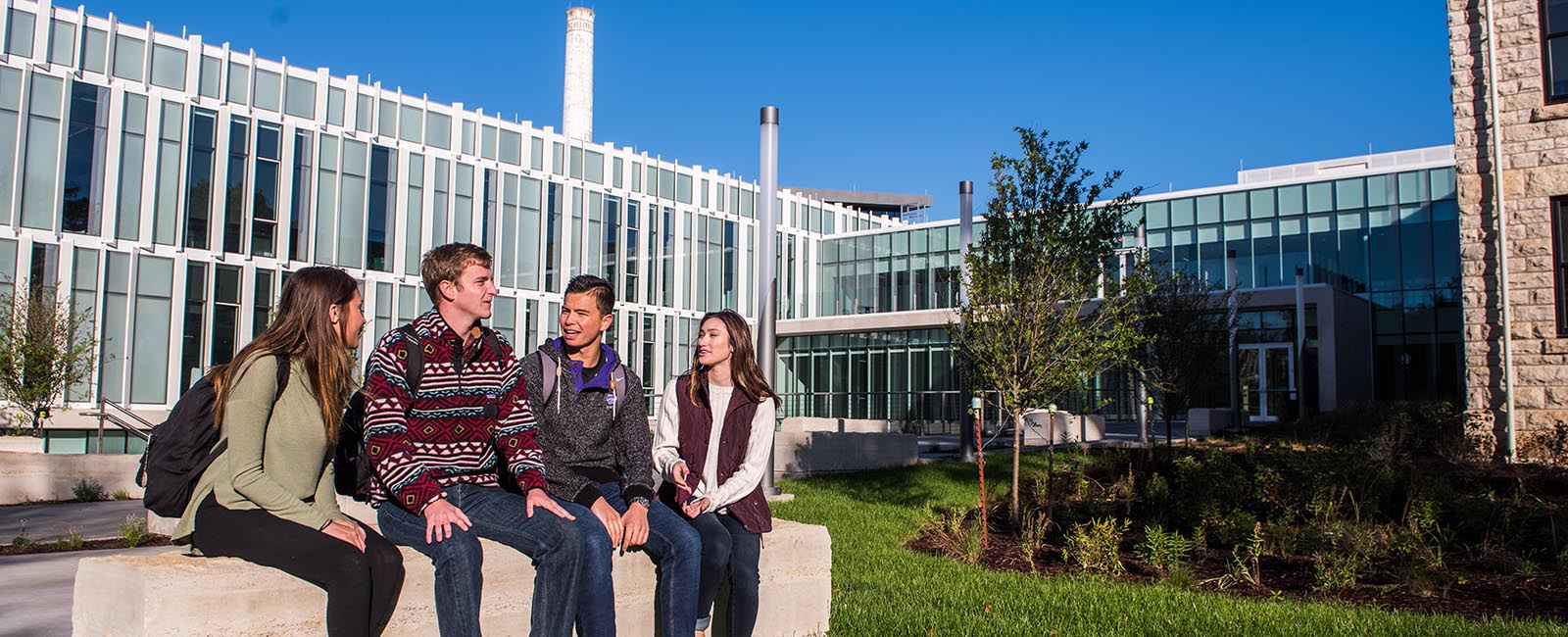 Students sitting and talking on campus