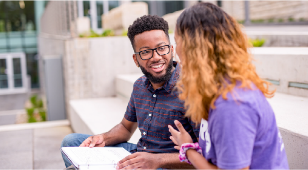 students on steps on campus