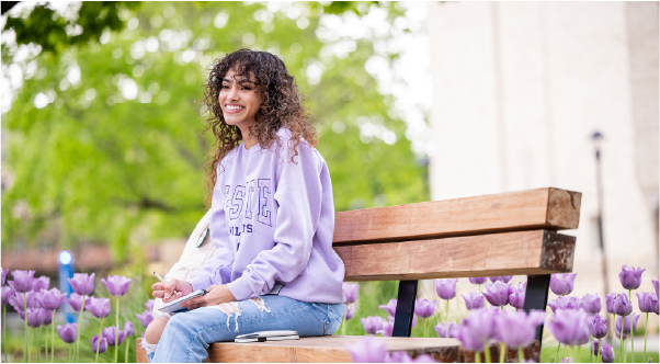 student sitting on a bench