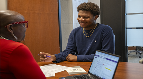 student talking with an advisor