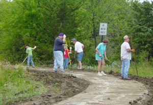 Photo of volunteers putting in a walking trail in Overbrook, Kan.