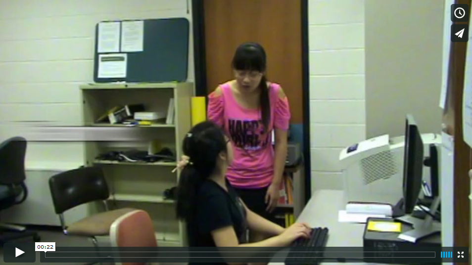 This is a screen grab of a video with two young women interacting.  