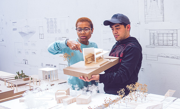 Professor and student collaborating on architecture project