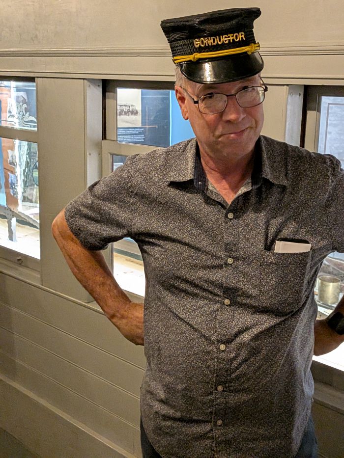 Tim wearing a conductor hat at the Kansas History Museum