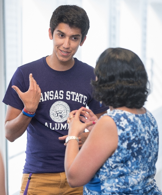 A student discussing his presentation