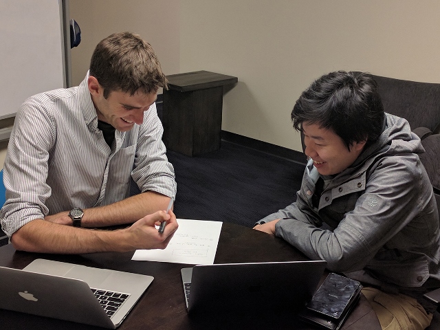 Student studying with a tutor