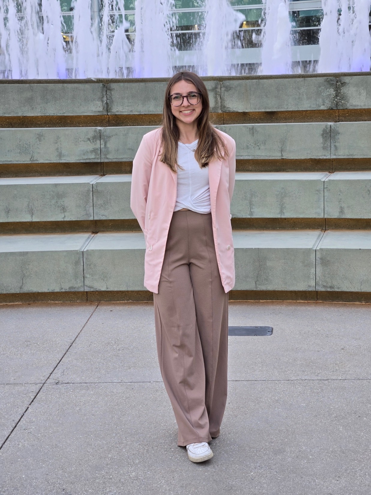 a photo of Sami Villasana in front of a water fountain