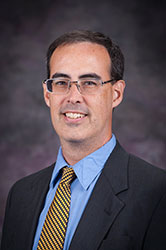 A photo of Adrian Self.