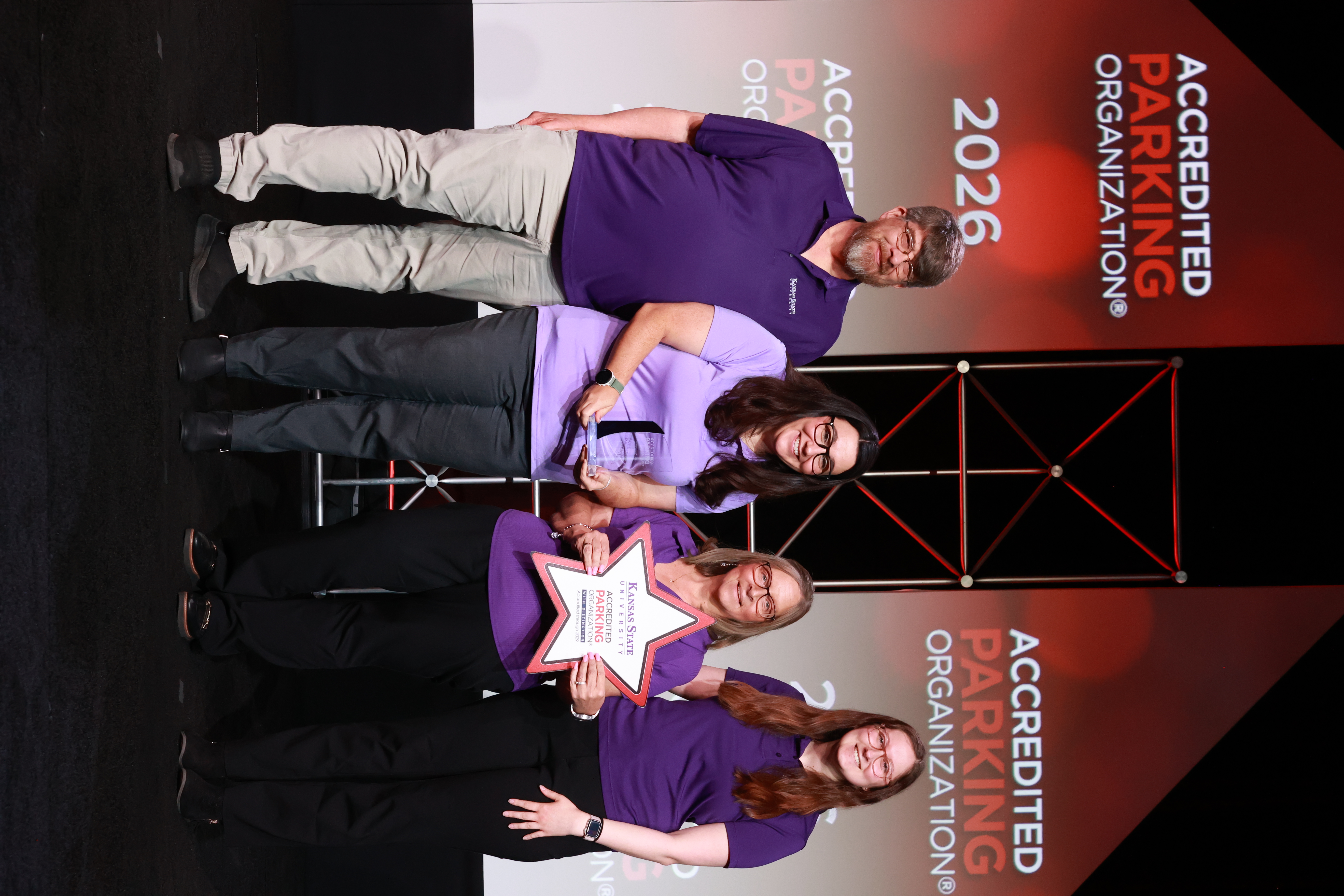 Staff members from Parking Services accept their award.