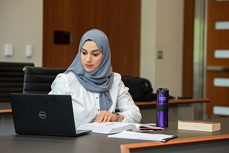 woman looking at laptop