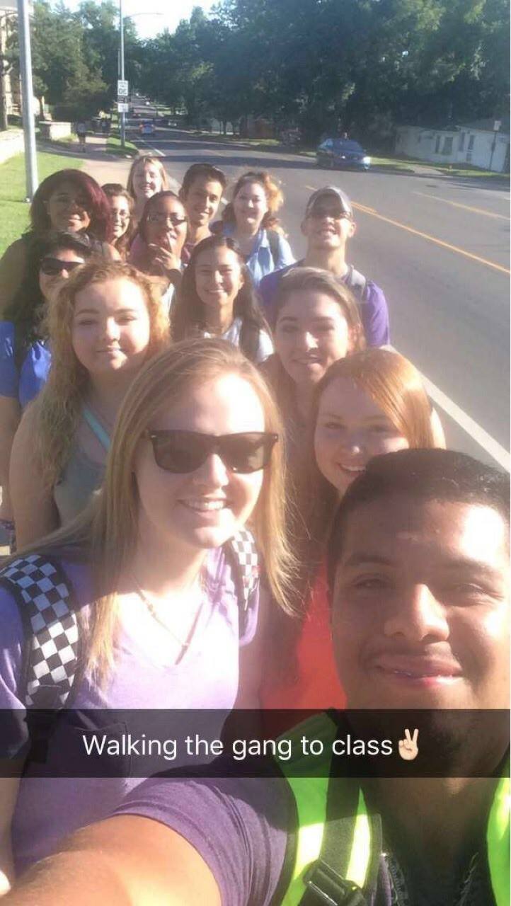 Students on the sidewalk going to class together