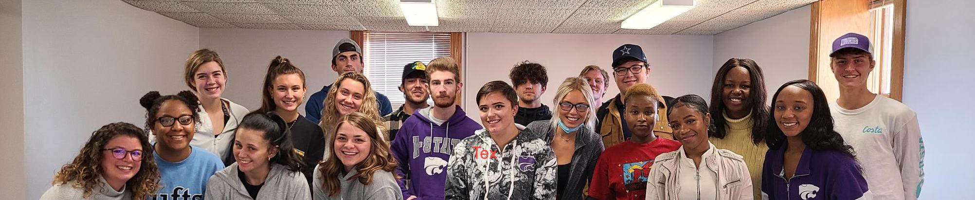 a group of students smiling at the camera