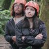 2 students listening to zip-lining instructions.