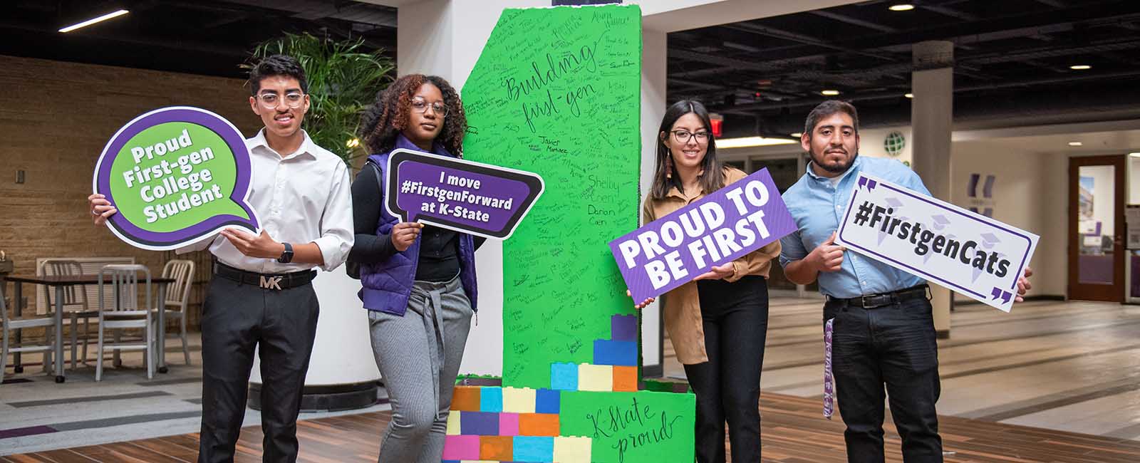 First generation students holding signs