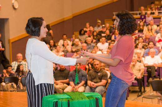 Student receiving green cord