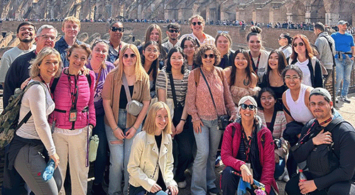 Students and faculty pose during an education abroad experience.