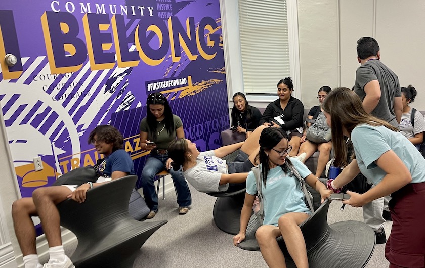 Students gathering in the first-gen lounge on wobble chairs.