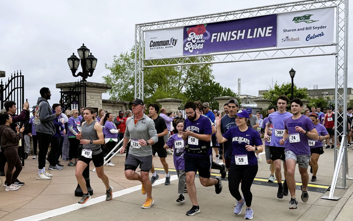 A large crowd of bystanders looks on as runners begin the 2025 Run for the Roses