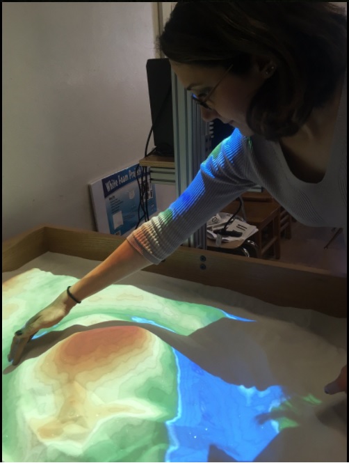 Dr. Farough using the augmented reality sandbox