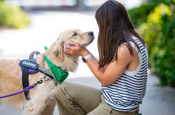 Oakley with student on campus