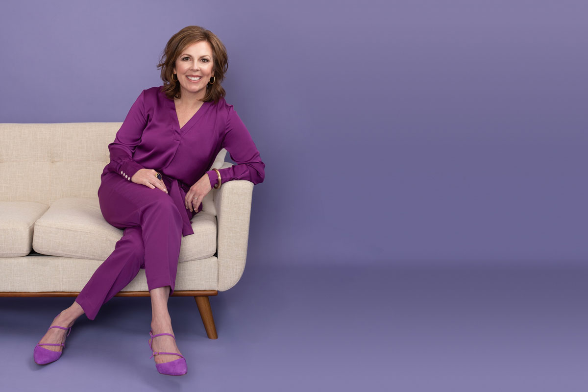 Sally Linton sitting on couch