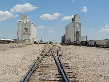 Train tracks between Goodland, KS, grain elevators