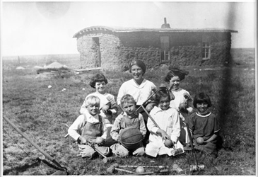 family in dugout home
