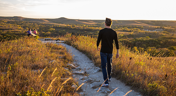 a man walking the konza prairie
