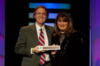 Associate Dean Debbie Mercer accepts the award.