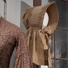 Linen prairie bonnet in Forces exhibit