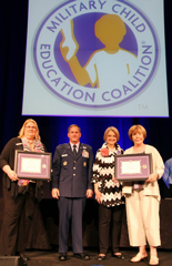 Sandy Risberg, left, and Jane Fishback, far right, accept the MCEC award.