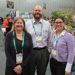 Shoemaker, Rivard, and Pliakoni (left to right) in the Exhibit Hall at the Congress