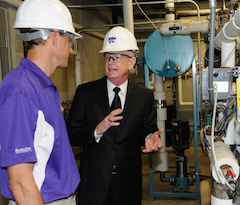 One of the sites where John Gamble (right) will provide environmental health and safety guidance is the O.H. Kruse Feed Technology Innovation Center, and he is pictured here with Charles Stark, faculty member, Department of Grain Science and Industry.