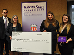 The Kansas State team accepts their honorable mention award.