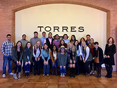 The group during a business tour of Torres winery. 
