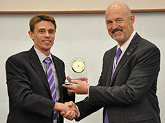 Brett Wilkinson, left, head of the K-State department of accounting presents Ken Selzer, right, with the K-State Accounting Hall of Fame award.