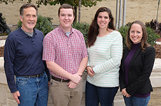 Kansas State University's Jordan Gebhardt, center left, and Laura Constance, center right, are again finalists in a national swine research poster competition. With Gebhardt and Constance are their College of Veterinary Medicine swine research mentors, St