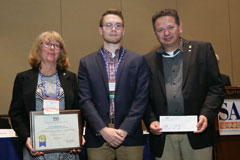 Jakob Hanschu in the middle receives AA Institute for Field Research Undergraduate Student Poster Award from Susan Chandler, president of the Society for American Archaeology, and Ran Boytner, executive director and founder of the Institute for Field Rese