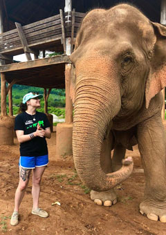Donovan with elephant at Elephant Nature Park, Thailand