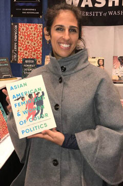 Shireen Roshanravan holding a copy of her recently published co-edited collection, Asian American Feminisms and Women of Color Politics, at the American Studies Association Celebration of Authors on November 8, 2018.