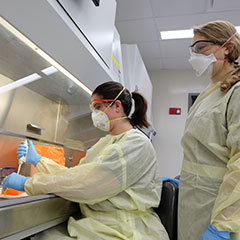Laura Constance and Rachel Palinski train at the Biosecurity Research Institute