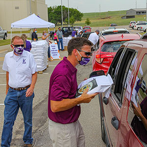 Volunteers distributed 1,500 bags of flour, milled at the Hal Ross Flour Mill on the K-State campus, on Thursday, June 18.