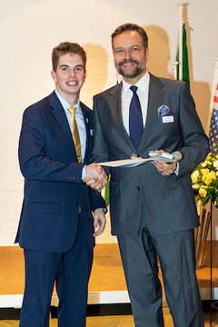  Junior in milling science and management, Cody Blodgett, receives his diploma from Michael Weber, Director of the Swiss Milling School. This diploma certifies Blodgett as a Milling Technologist SMS.  