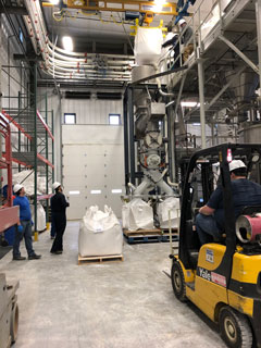 Staff members at the Kansas State University Bulk Solids Innovation Center test fine, sticky powder from the global chemical company with which it is working.