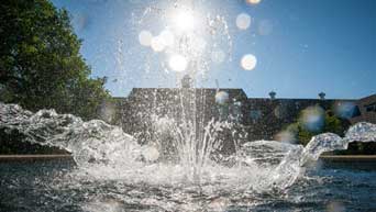 Water splashes in the fountain at the Kansas State University Gardens.