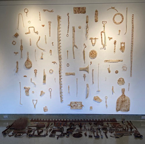 Pat Hickman, “Remembrance” (installation), 2021, hog casings, rusty farm implements