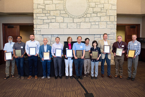K-State inventors and breeders holding their 2021 U.S. patent or plant variety protection certificate plaques.