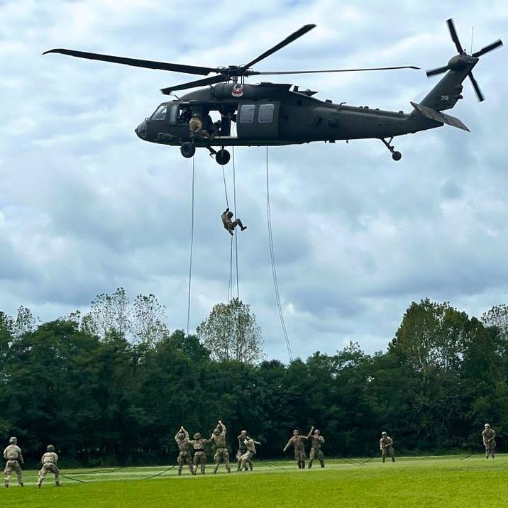 Cadet Carson Paul's class conducts rappel from UH-60 Blackhawk helicopter.